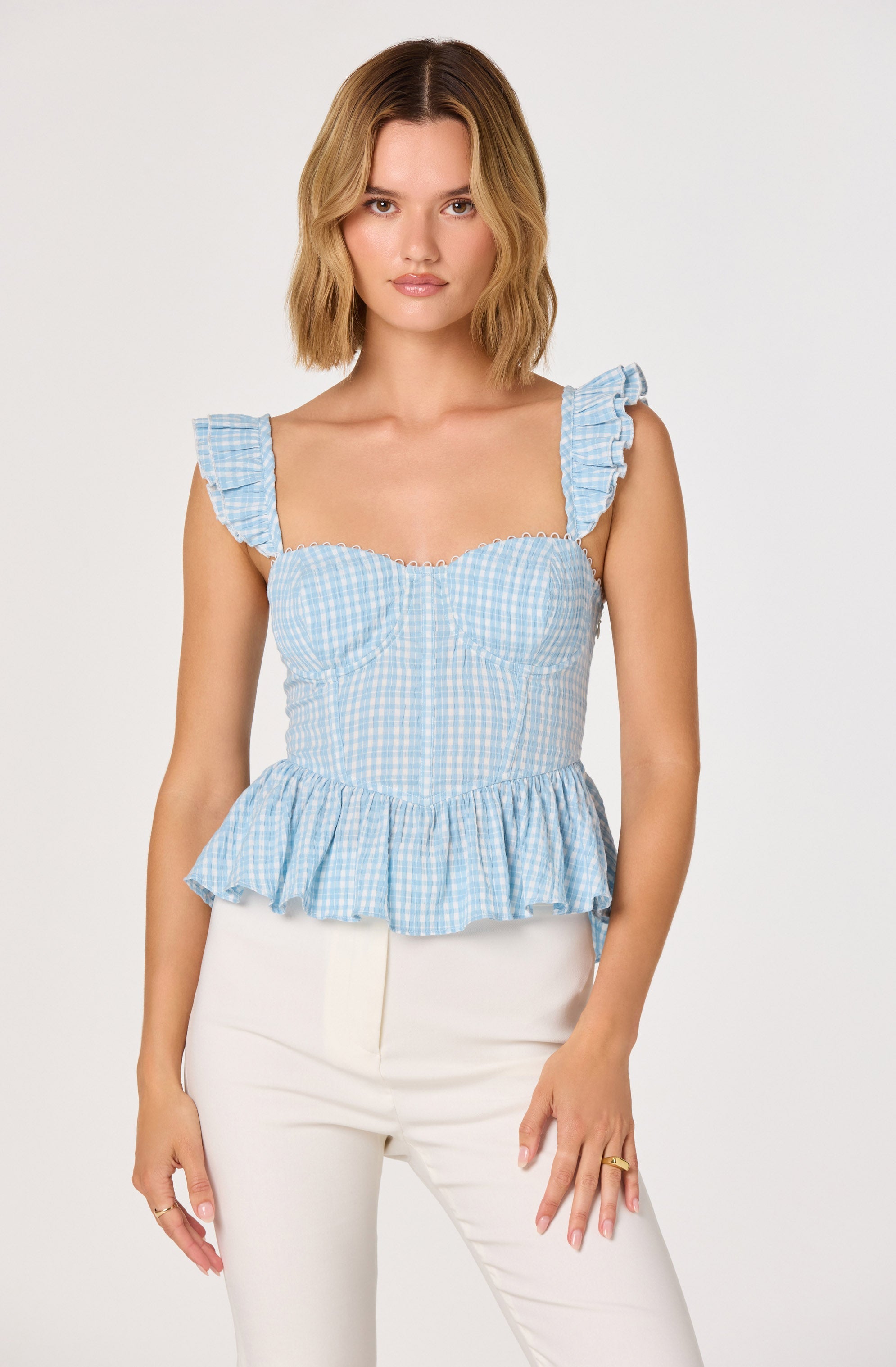 Baylin Eyelet Corset Peplum Top
