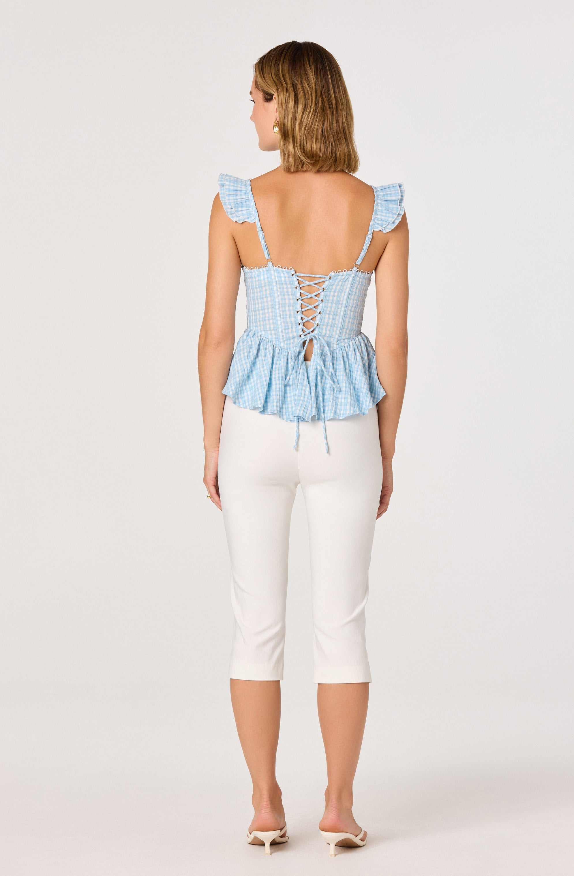 Baylin Eyelet Corset Peplum Top