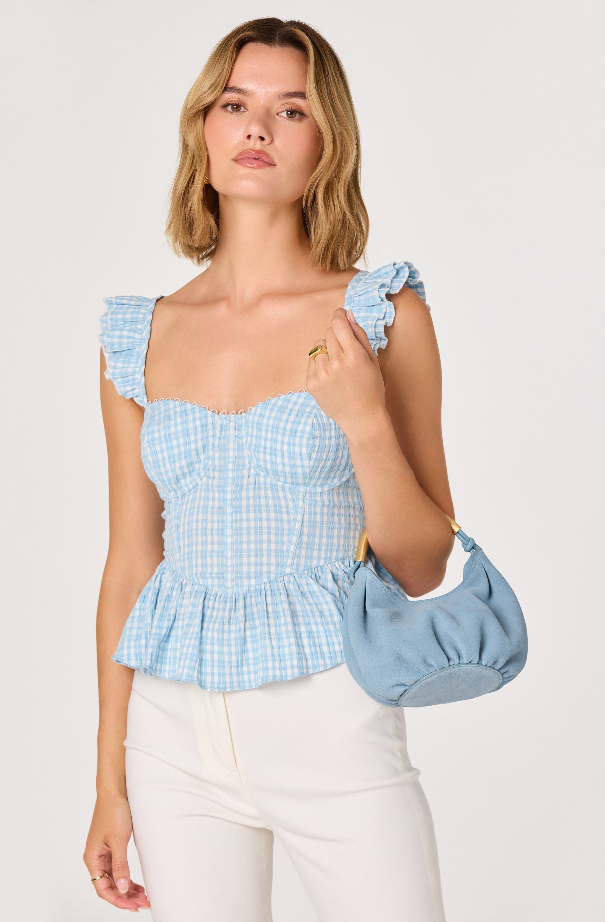 Baylin Eyelet Corset Peplum Top